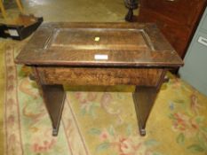 A SMALL OAK OCCASIONAL TABLE WITH HINGED LID