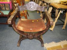 A CARVED 'X-FRAME' CEREMONIAL ARMCHAIR