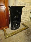 A SMALL ORIGINAL CAST FIREPLACE WITH BRASS FENDER