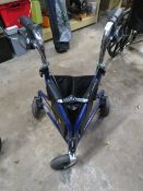 A FOLD AWAY TRI-WALKER WITH SHOPPING BAG