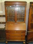 A VINTAGE OAK BUREAU BOOKCASE