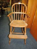 A SMALL ANTIQUE CHILDS WINDSOR HIGH CHAIR