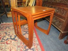 A MID CENTURY G-PLAN NEST OF TEAK TABLES
