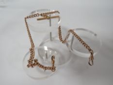 A GENTS ANTIQUE YELLOW METAL POCKET WATCH DOUBLE ALBERT CHAIN