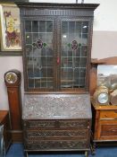 A LARGE VICTORIAN CARVED OAK BUREAU BOOKCASE H-224 W-110 CM