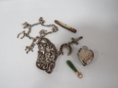 A SMALL BAG OF COLLECTABLE'S TO INCLUDE A SILVER CHARM BRACELET STAMPED STERLING, SMALL JADE PENDANT