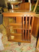 A VINTAGE OAK REVOLVING BOOKCASE