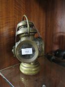 A BRASS RAILWAY LAMP