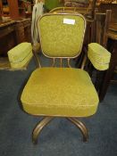 A MID CENTURY INDUSTRIAL STYLE SWIVEL ARMCHAIR