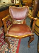 AN UPHOLSTERED VINTAGE ARMCHAIR