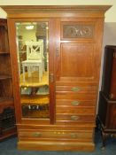 AN EDWARDIAN MAHOGANY MIRRORED WARDROBE