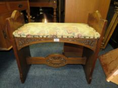A CARVED OAK AND UPHOLSTERED BENCH SEAT - W 66 CM