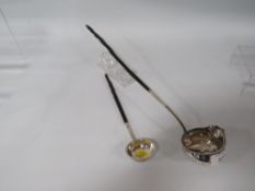 TWO WHITE METAL PUNCH LADLES WITH EBONISED HANDLES