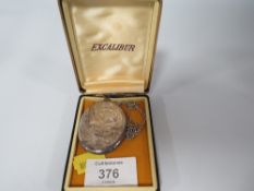 A LARGE HALLMARKED SILVER ENGRAVED LOCKET ON CHAIN
