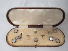 A CASED ART-DECO CUFFLINK AND STUDS SET
