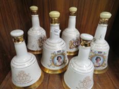 A SET OF SIX BELLS SCOTCH WHISKY DECANTERS