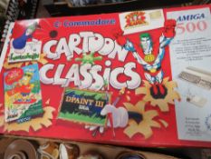 A BOXED COMMODORE AMIGA 500 TOGETHER WITH A SMALL SELECTION OF GAMES (ALL UNCHECKED)