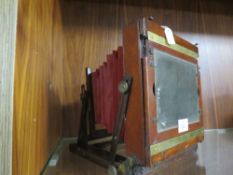 A VINTAGE MAHOGANY FOLDING PLATE CAMERA A/F