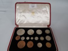 A CASED SET OF GEORGE VI SPECIMEN COINS 1937, in fitted red Moroccan leather case, W 18.5 cm