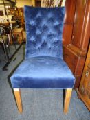 A MODERN ELECTRIC BLUE UPHOLSTERED CHAIR