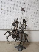 AN UNUSUAL METAL KNIGHT ON HORSEBACK SCULPTURE