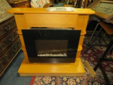 A MODERN ELECTRIC FIRE/HEATER IN SURROUND - INSTRUCTIONS REMOTE