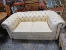 A CREAM CHESTERFIELD SETTEE