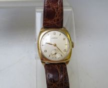 A 9 CARAT GOLD VERTEX WRIST WATCH WITH PRESENTATION ENGRAVING TO REVERSE, circa 1958, in Garrard &