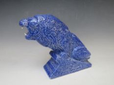 AN ASHSTEAD POTTERS (1923-35) LION ADVERTISING FIGURE, for Genozo toothpaste, in a blue glaze, H