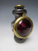 A VINTAGE MODEL T FORD REAR TAIL LAMP