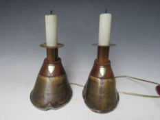 A PAIR OF HORSE HOOF CANDLE STICKS, converted to table lamps, each with an attached shield inscribed