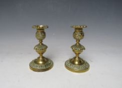 A PAIR OF 19TH CENTURY GILT BRONZE CANDLESTICKS, H 13 cm, base Dia. 8 cm