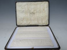 THREE GRAND TOUR STYLE PLAQUES, depicting classical friezes of horsemen, in leather bound case, each