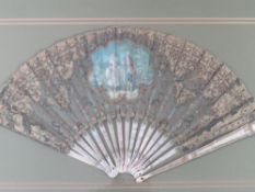 A LATE 18TH / EARLY 19TH CENTURY PAINTED AND DECORATIVE FAN, the central study depicting a couple in