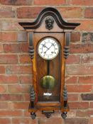 A MAHOGANY CASED VIENNA GONG STRIKE WALL CLOCK, having an 8 day German movement and white enamel