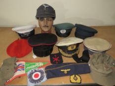 A COLLECTION OF VARIOUS MILITARY CAPS AND BERETS ETC., to include Naval and German types, along with