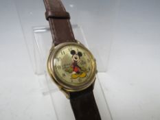 A MICKEY MOUSE QUARTZ WRISTWATCH WITH MELODY ALARM BY LORUS, Dia. 3 cm