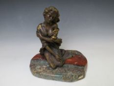 AN EBANO BRONZED SCULPTURE FROM THE VIDAL COLLECTION DEPICTING A KNEELING SEMI NUDE GIRL, raised