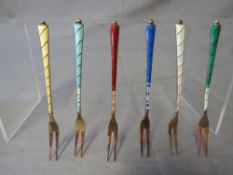 A CASED SET OF SIX NORWEGIAN STERLING SILVER AND ENAMEL PICKLE FORKS, A/F