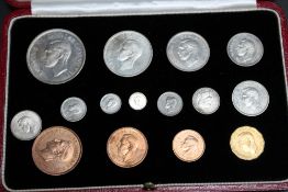 A CASED SET OF GEORGE VI SPECIMEN COINS 1937, in fitted red Moroccan leather case, W 18.5 cm