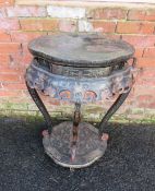 AN ORIENTAL EBONISED TWO TIER JARDINIERE STAND, decorated in typical style with gilt and coloured