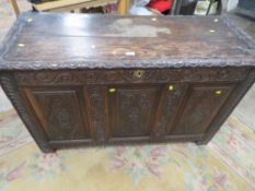AN ANTIQUE CARVED OAK COFFER W -124 CM