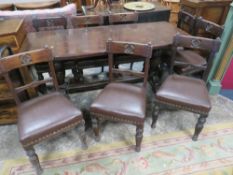 A VINTAGE OAK REFECTORY TABLE WITH EIGHT OAK GOTHIC STYLE CHAIRS