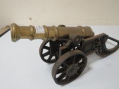 A LARGE VINTAGE CAST DESK CANNON