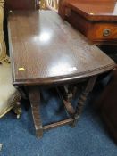 AN OAK BARLEYTWIST DROPLEAF TABLE