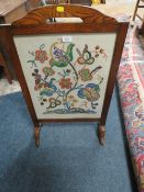 AN OAK GLAZED FIRESCREEN