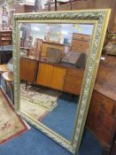 A LARGE MODERN GILT WALL MIRROR 142 X 110 CM