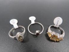 THREE ASSORTED SILVER DRESS RINGS