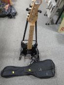 A CHILD'S ELECA ELECTRIC GUITAR WITH STAND AND CARRIER BAG