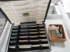 A CASED SET OF SILVER SMALL HANDLED KNIVES TOGETHER WITH A BOX COINAGE